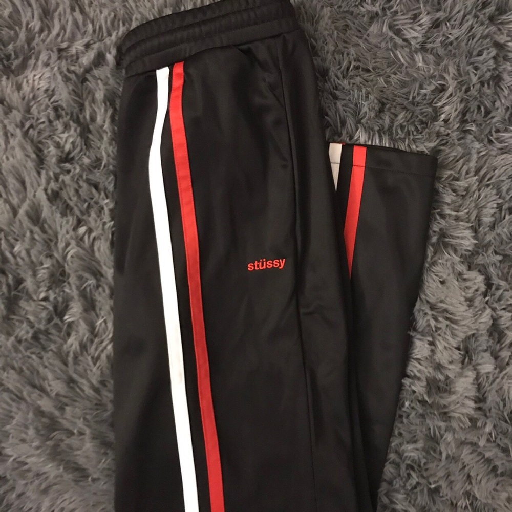 Brand new Stussy track pants with front stripes